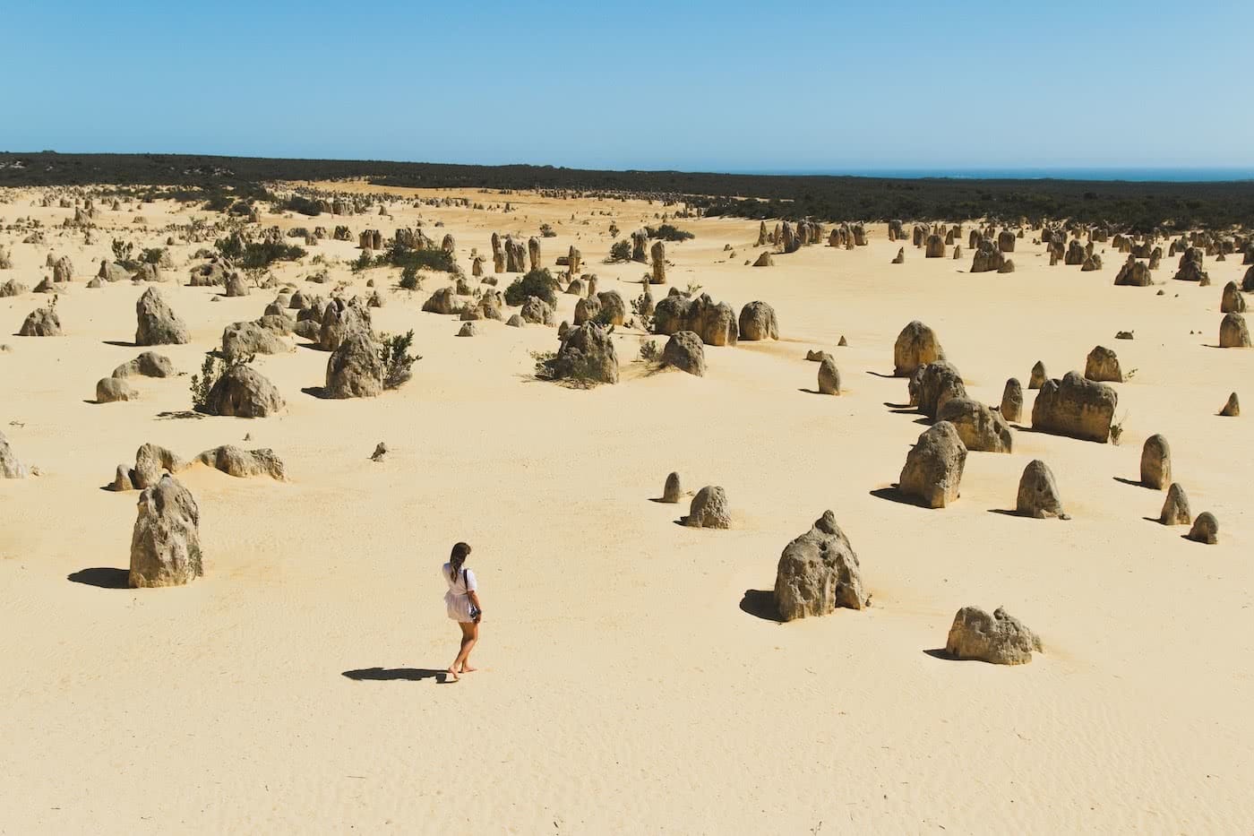 The Pinnacles // Sculptures in the Desert (WA) Eliska Kyrsova, photo Jono Tan, desert, sand, woman, space, rock formations, snadstone