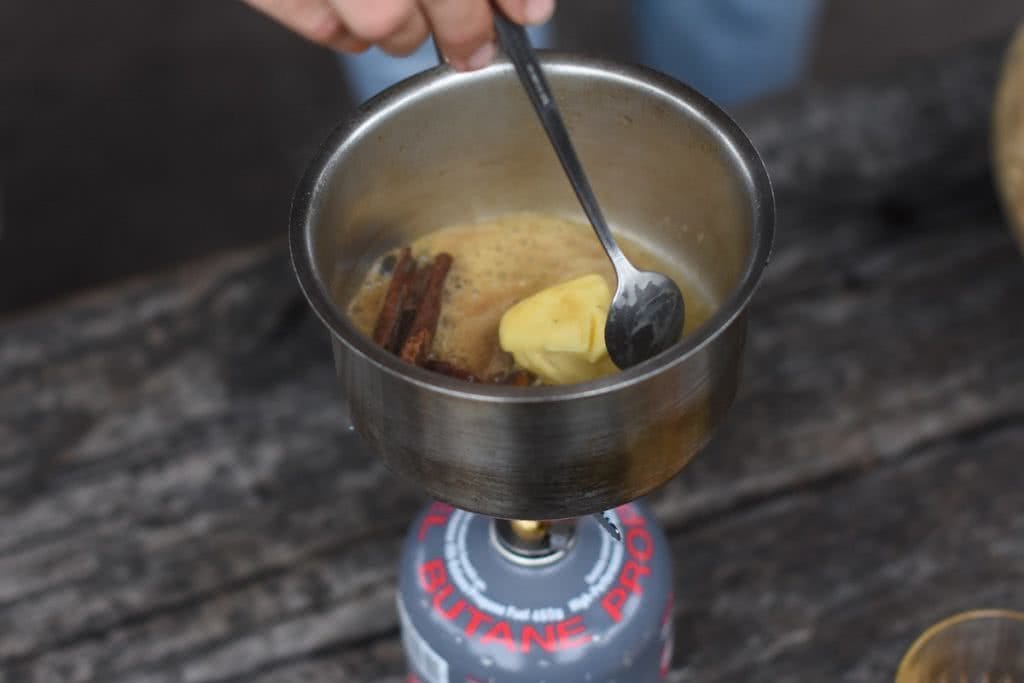 Winter Campfire Cocktails, Henry Brydon, butter, cinnamon, spoon, stove, pan