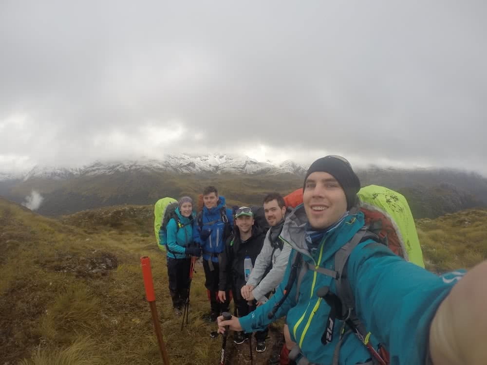 The Hardest Hike in New Zealand // Dusky Track, Tim Ashelford, photo by mitch stewart, selfie, fog, mist, hikers, crew, group, cloudy, heath, grassland, snow, mountains, rain cover