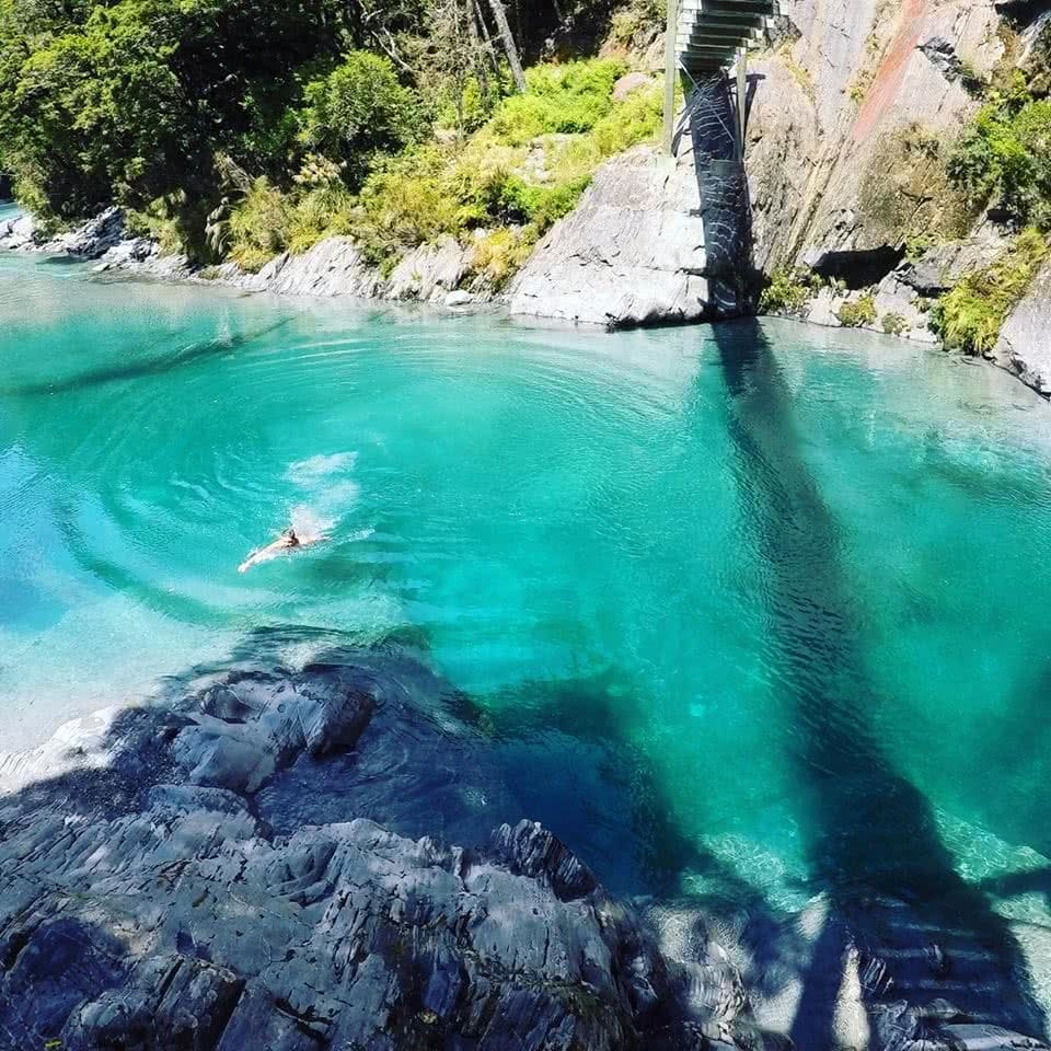 Bridge Jumping At Blue Pools // Haast Pass (NZ) tiffany hulm, water, aerial view, turquoise, trees, swimmer, solo, alone, uncrowded