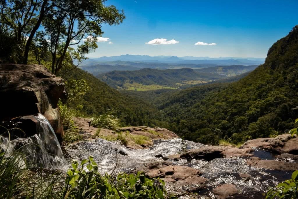 Lisa Owen_BestBeginnerHikesBrisbane_MoransFalls, Waterfall, mountains, horizon, tree, sky
