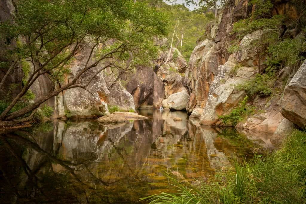 Lisa Owen_BestBeginnerHikesBrisbane_LowerPortalsWaterhole, water, swimming hole, reflection, rocks