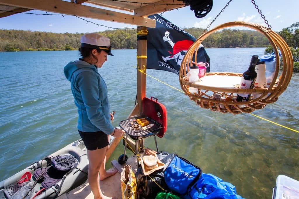 Travels By Tide // A Modern Day Huck Finn Adventure Joel Johnsson, captain, raft, basket, flag