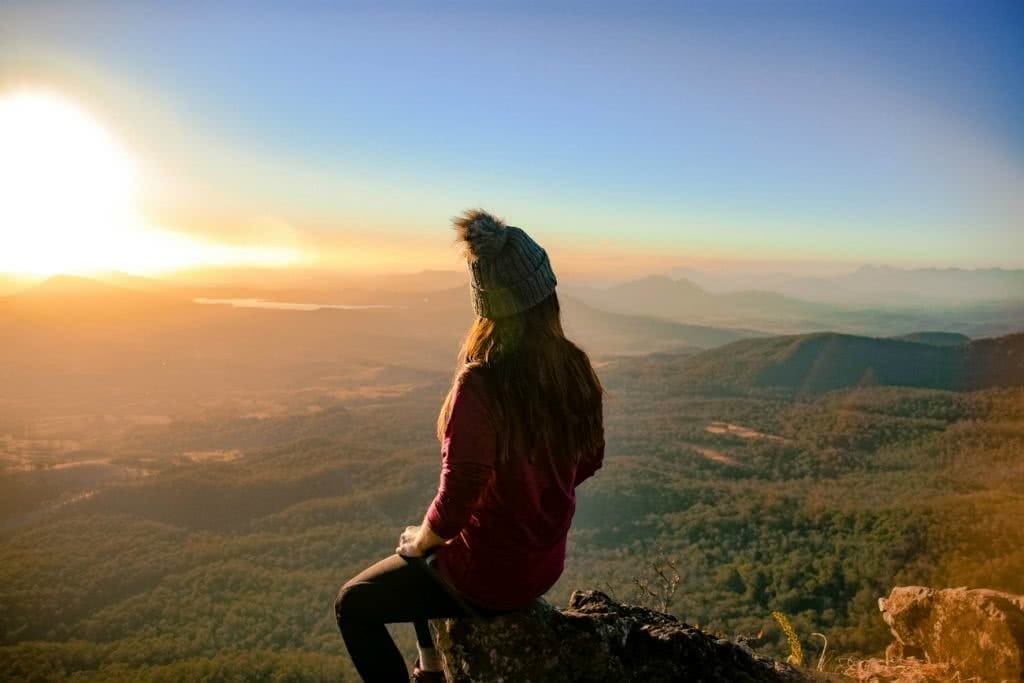 Sunrise_MtCordeaux Why I wake Up At 2am Every Weekend Lisa Owen, woman, bobble hat, down jacket