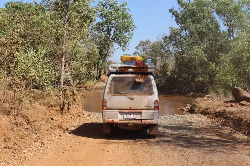 Red Dust // A Journey Along The Gibb River Road (WA) Ashlee Kehoe, van, dirt road, dust, trees, roofracks