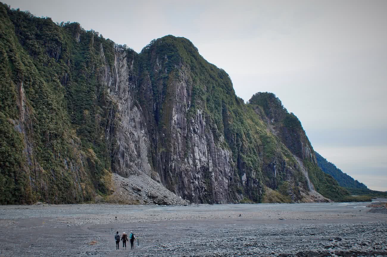 A Stroll Around Fox Glacier Valley // (NZ) Alex Kostas, huge cliffs, tiny hikers