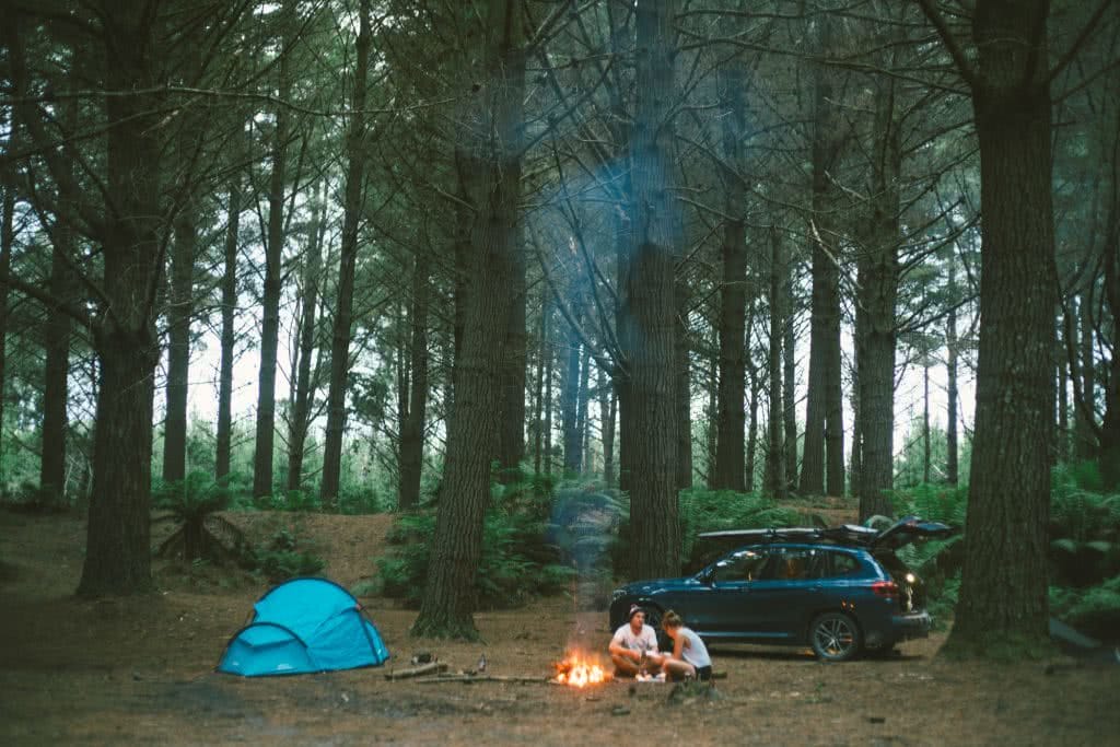 12 Things To Do On Tassie’s West Coast, photo by Mitch Cox, Pine Forest, camping, tent, people, car