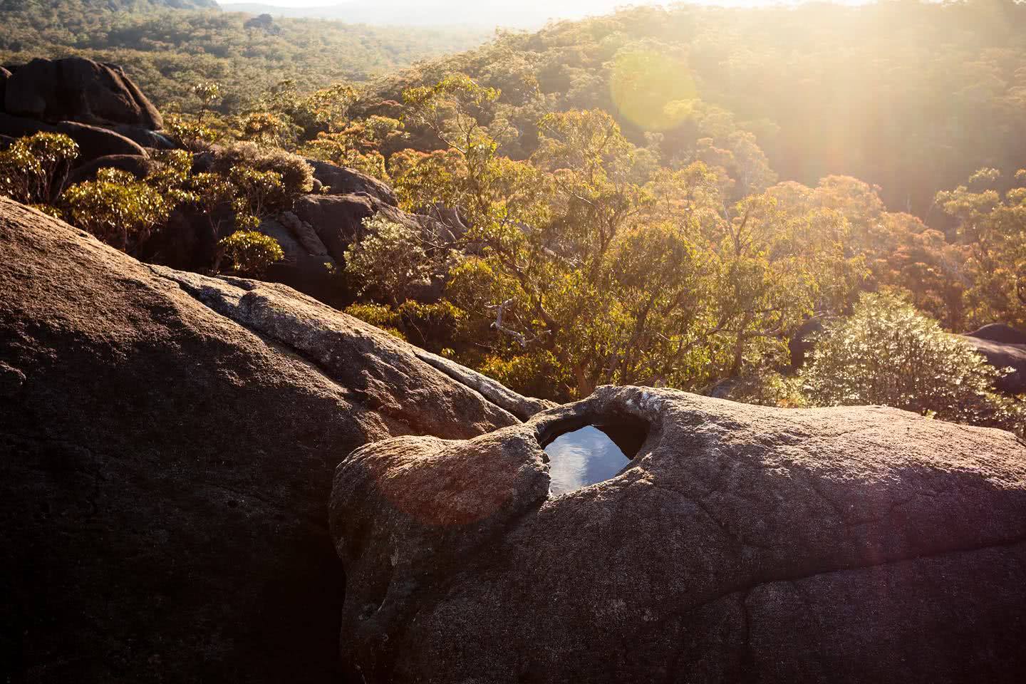 liam hardy, woolpack rocks, cathedral rocks national park, boulders, sunset, water, lens flare