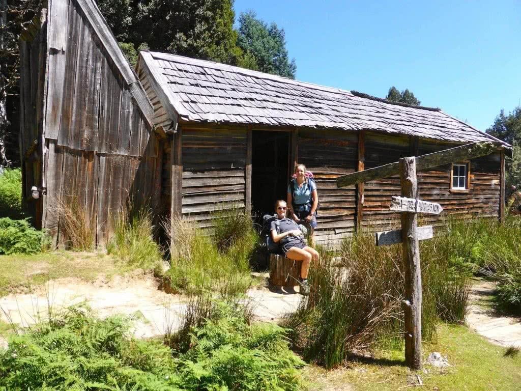 Highlights Of The Overland Track (VIC) Ducane Hut - Sarah Barlow, Photo Jo Barlow, hikers, signpost, rest, seat