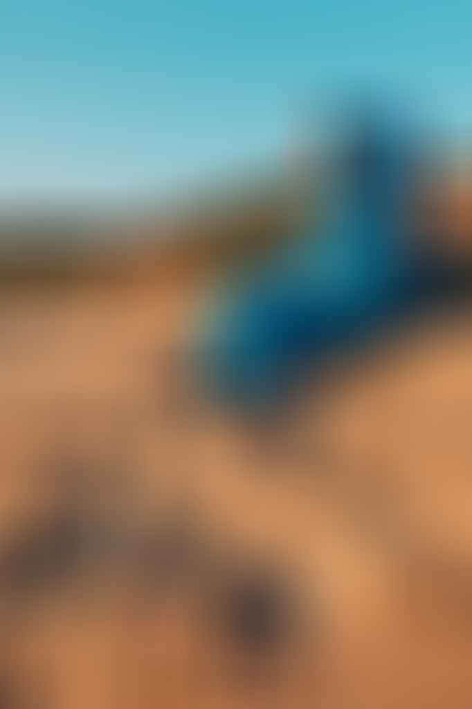 Blackwolf Hiker 500 Sleeping Bag // Gear Review, Caleb Hindley, woman, blue, hat, beach, sand dune, view, looking out