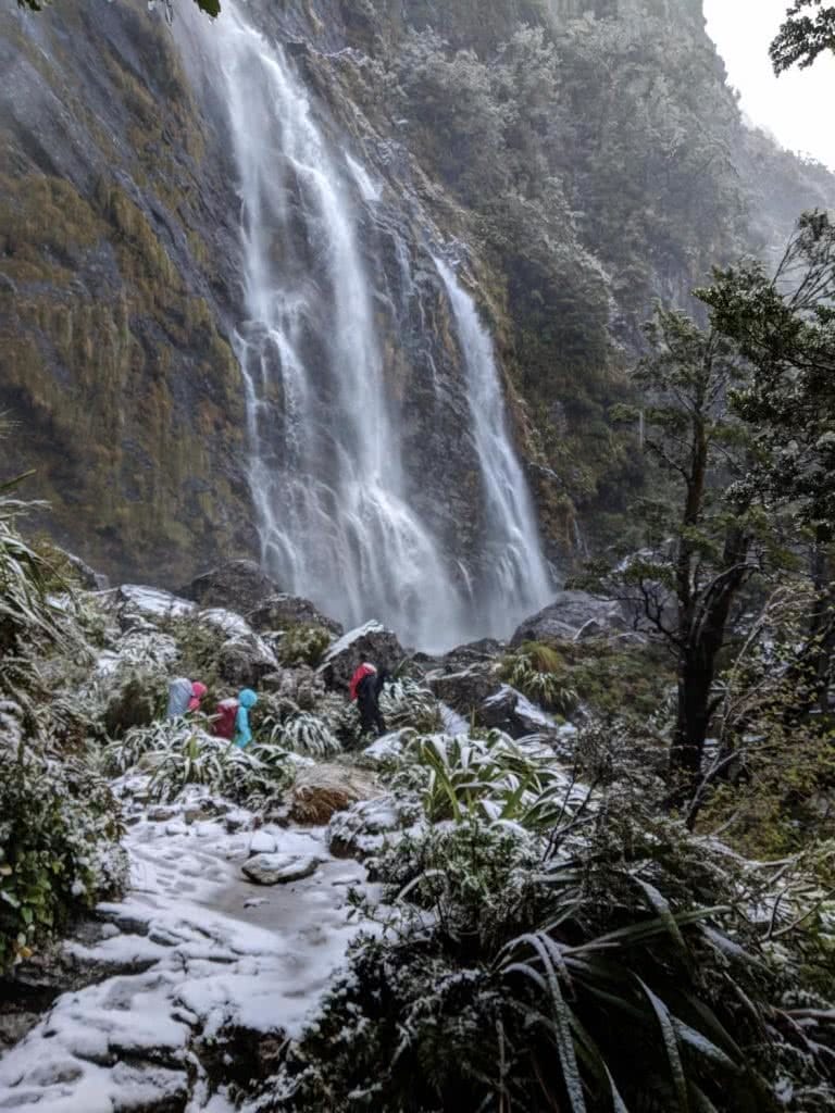 Soggy, Snowbound And Stoked // Routeburn Track (NZ), Rachel Dimond, Day 3 - Earland Falls, waterfall, waterproofs, mountains