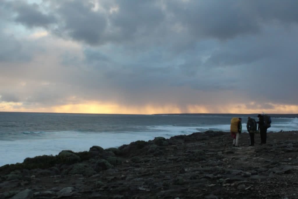 How Not To Hike (I Learned The Hard Way), Saphira Schroers,, storm, horizon, hikers, pebbles, beach, ocean, rain, sunset, getting dark