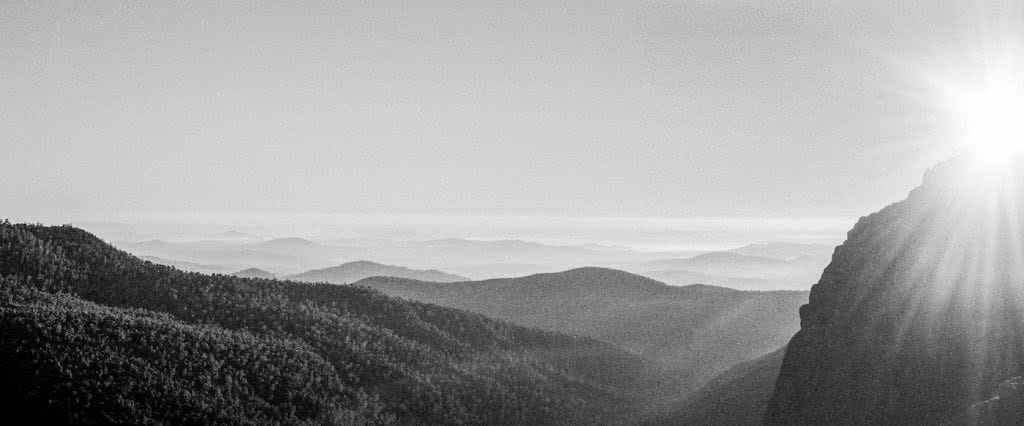 A Blast Up Booroomba Rocks // Namadgi NP (ACT), Dan McInnes, mountains, range, black and white, distance, view, sunburst, panorama, hero