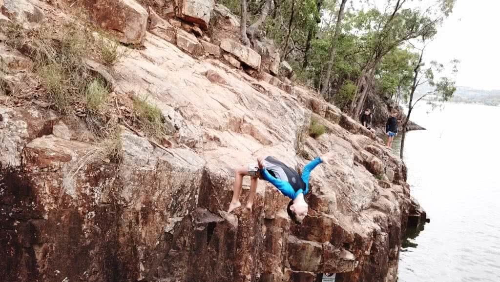 Rock Jumps At A Secret Gorge // Lake Moogerah (QLD), Kate Bennie, cliff jump, wetsuit, rocks
