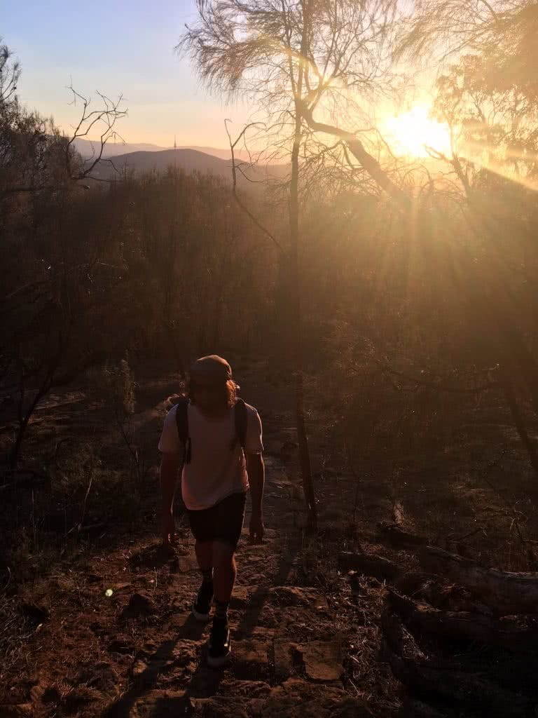 Saturday Night In The City // Mt Majura Sunset Hike (ACT), Mattie Gould, Hike up, sunset, backpack, hazy, backlit
