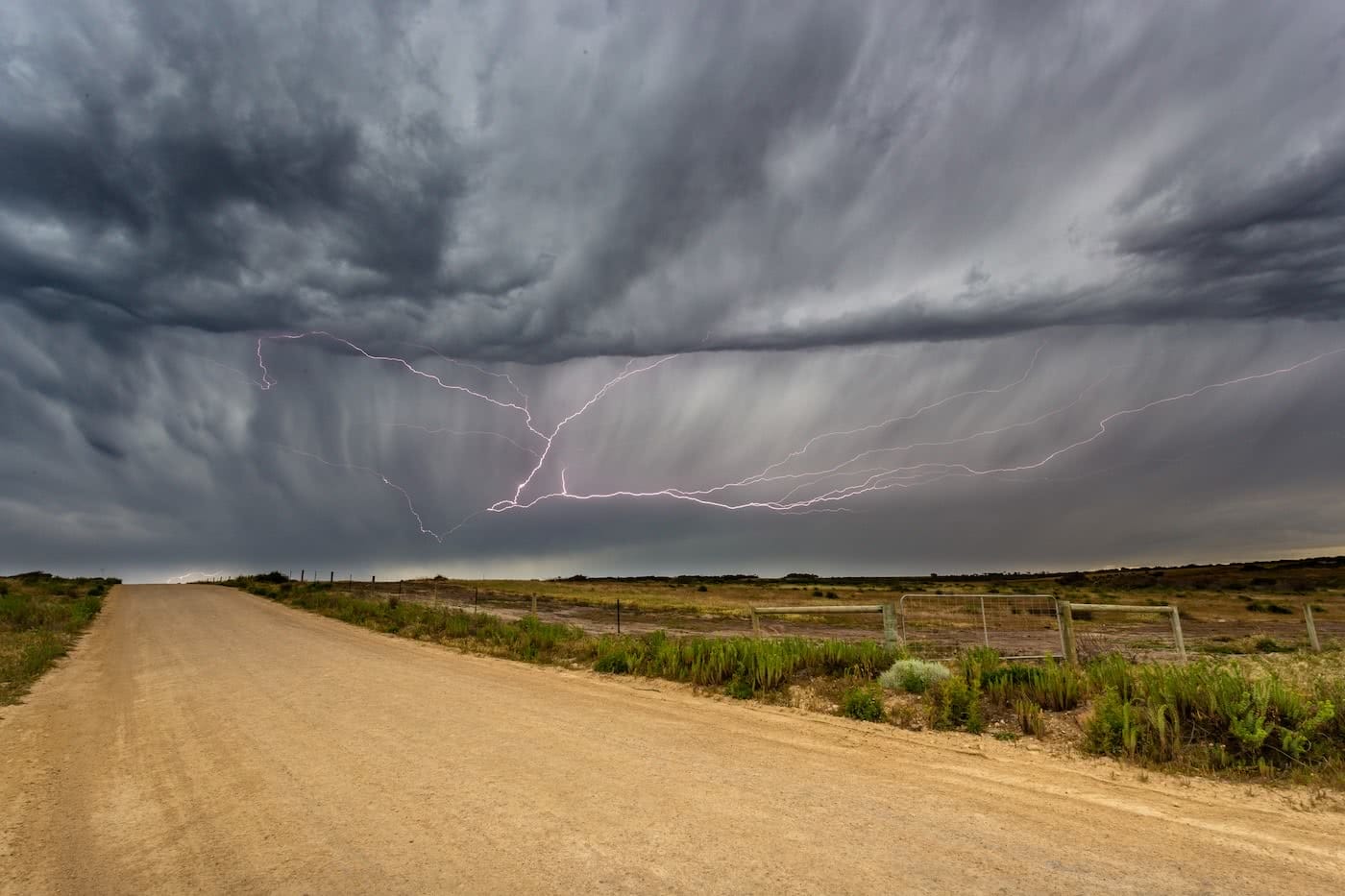 A Hiker’s Guide To Lightning Safety, Xavier Anderson, sleaford storm, photo Luke Gardener, storm, dirt road, plains, clouds, moody, dramatic, hero