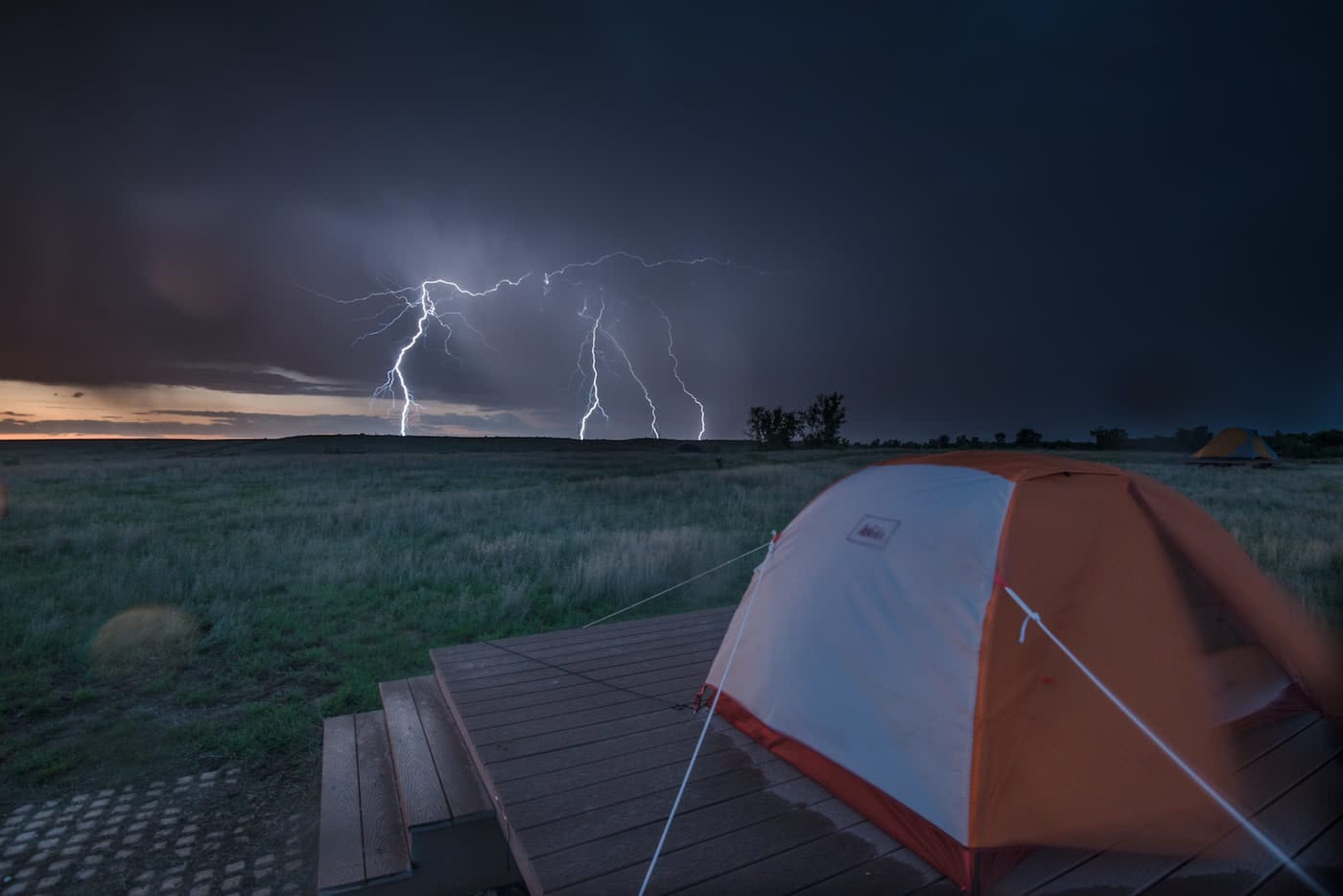A Hiker’s Guide To Lightning Safety, Xavier Anderson, photo Morgan_Cardiff, grass, storm, horizon, tent, camping platform