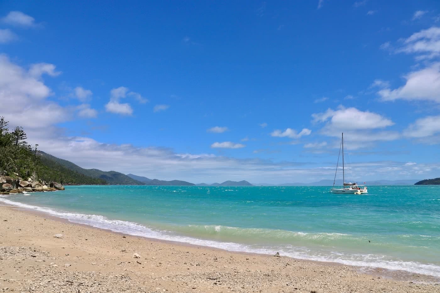 Camping The Whitsundays // Cairn Beach Campground (QLD), Solaye Snider, beach, turquoise, ocean, boat, sand, shore
