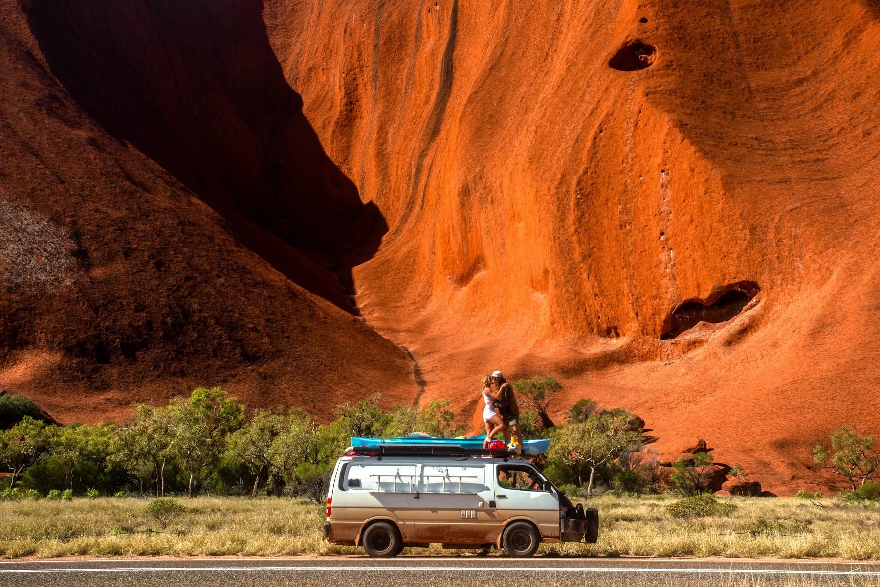What We Learnt From 4 Years On The Road // Van Life Revisited, mitch cox, Uluru love mitch, rooftop, couple, red rock