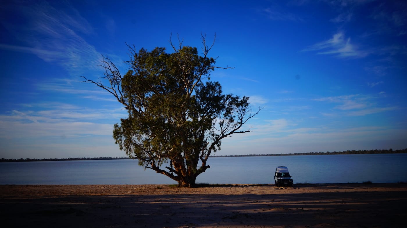 Troopy Travels // Chasing Sunsets From Byron Bay To The Ningaloo Reef, Alice Forrest, Lake Benanee SA, photo by Angel Grimaldi, tree, view, van life, water