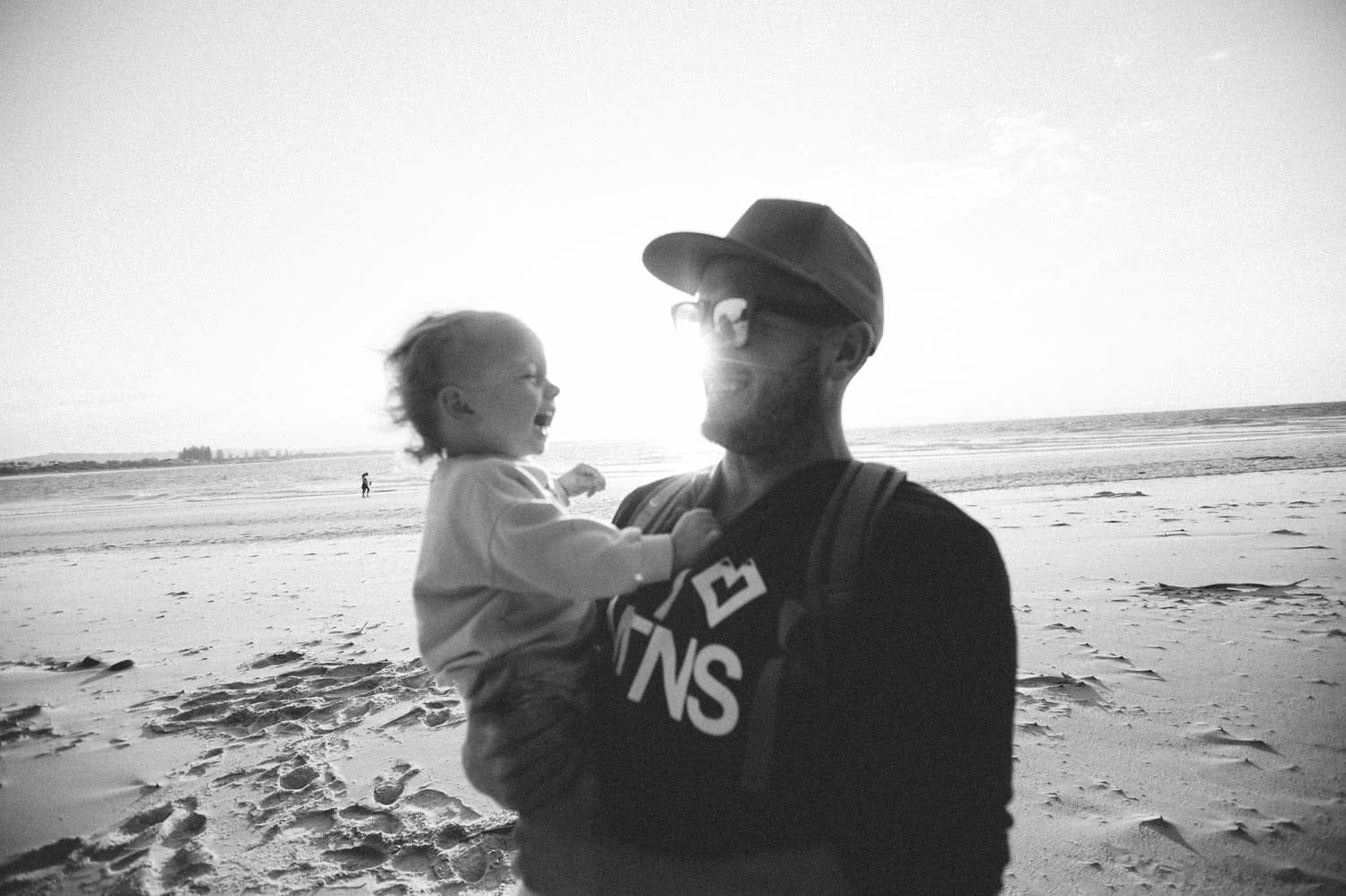 father and son on beach henry brydon