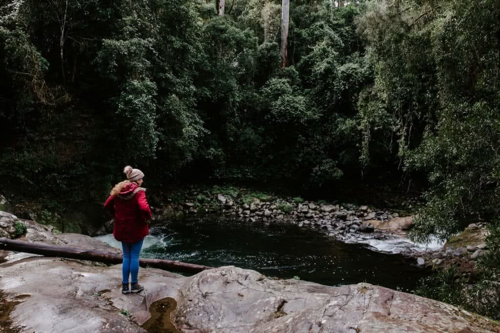 A person standing on a rock