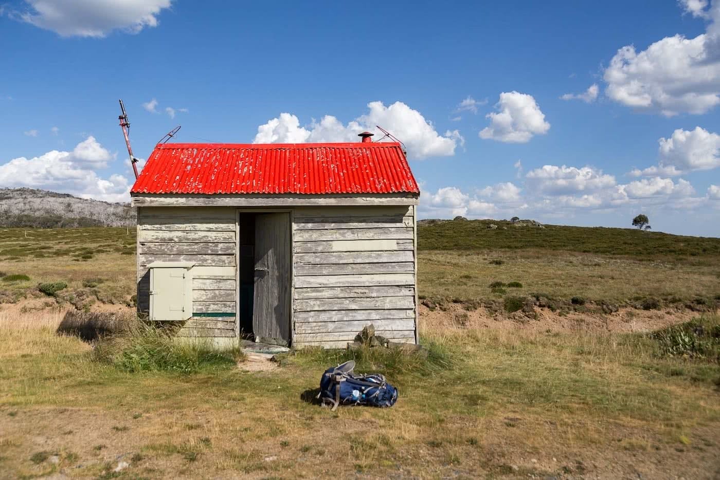 The High Plains on Foot – Four Day Falls Creek Circuit (VIC) Lachlan Fox backcountry hut, red tin roof
