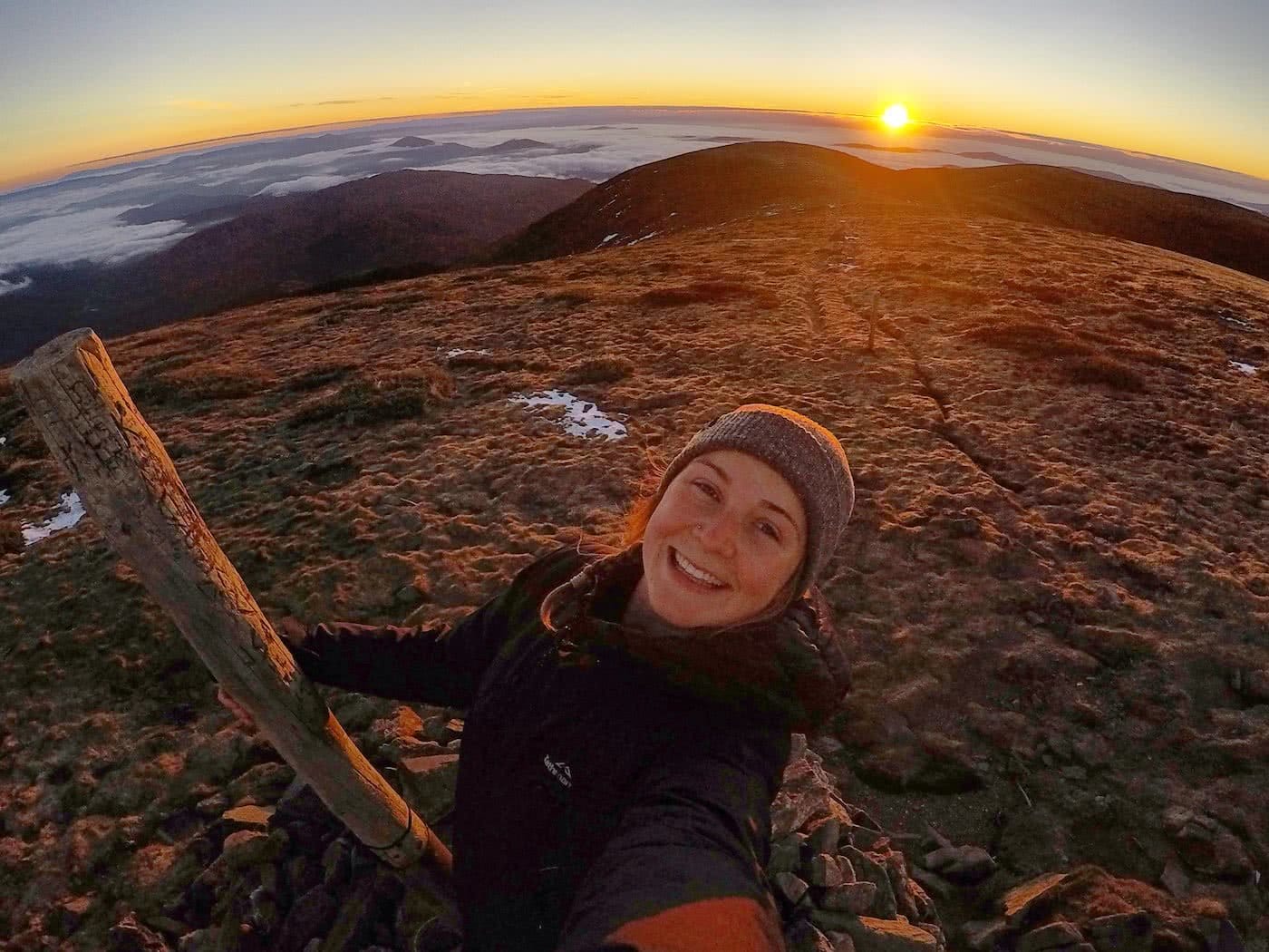 A person sitting on a rock