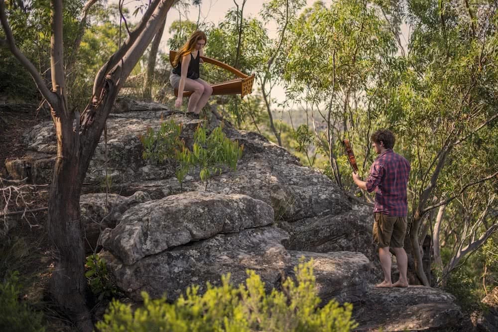 This Couple Is Thru-Hiking Between Concerts Across NZ, Mickey and Michelle, photo by Daniel Di Biase, harp, fiddle, blue mountains