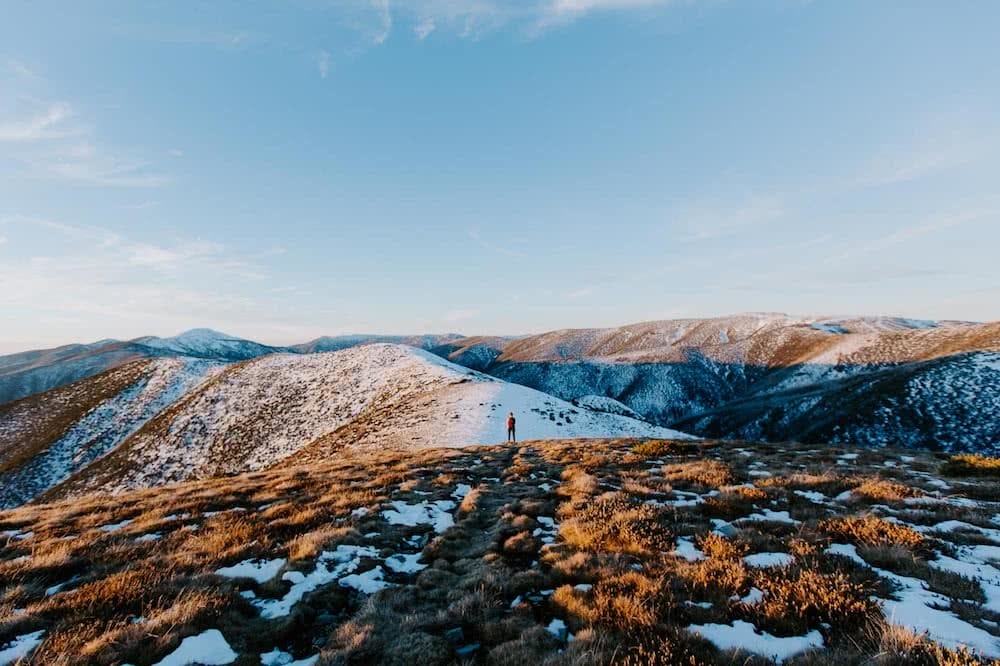 First-Time Alpine Hiking On Mt Buffalo (VIC) by Cedric and Melody Tang, XTM Performance jacket, sunset in the snow, backpack