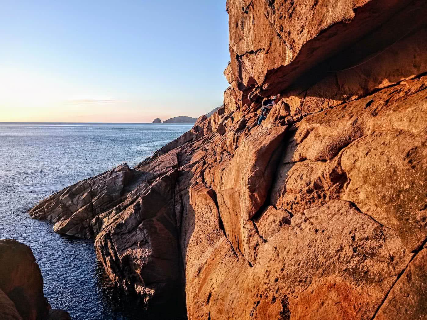 Searching for redemption on the Freycinet Sea Level Traverse, by Polly Barr, sunrise, climber