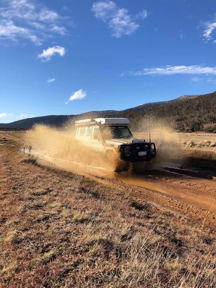 Van Or 4WD – Which Vehicle is Better For Exploring Australia?, 4wd life, toyota troop carrier, photo by conor moore, mud puddle