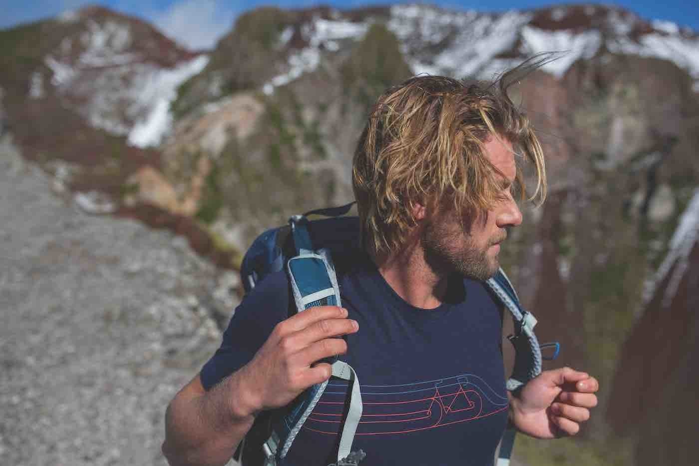 7 Weird Ways You Can Help Save the Planet, photo supplied by Icebreaker, man, t-shirt, backpack, mountain, New Zealand