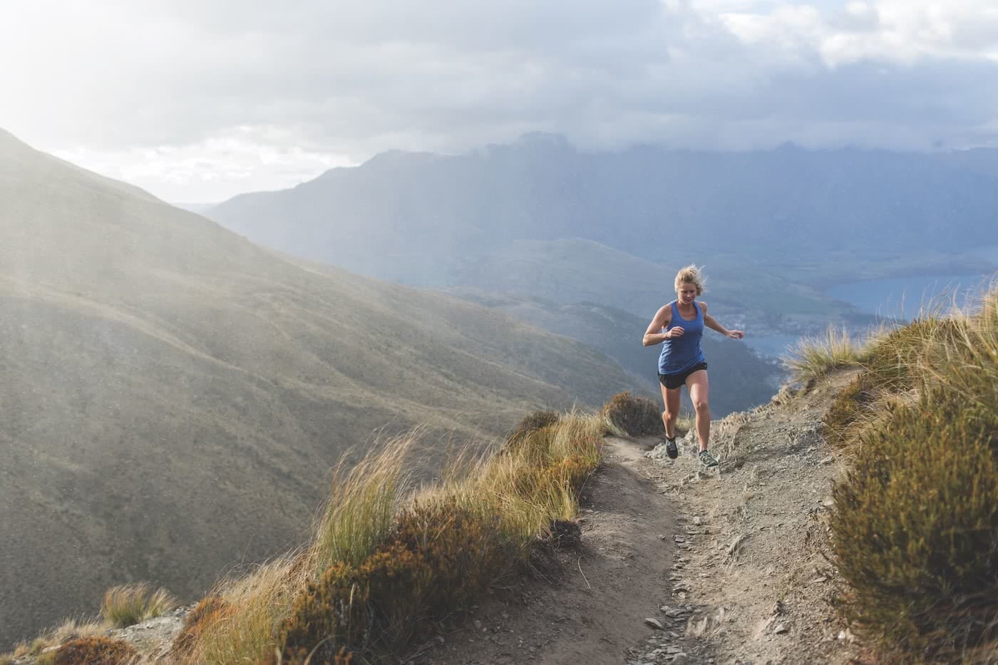 7 Weird Ways You Can Help Save the Planet, photo supplied by Icebreaker, woman, running, t-shirt, mountains, New Zealand