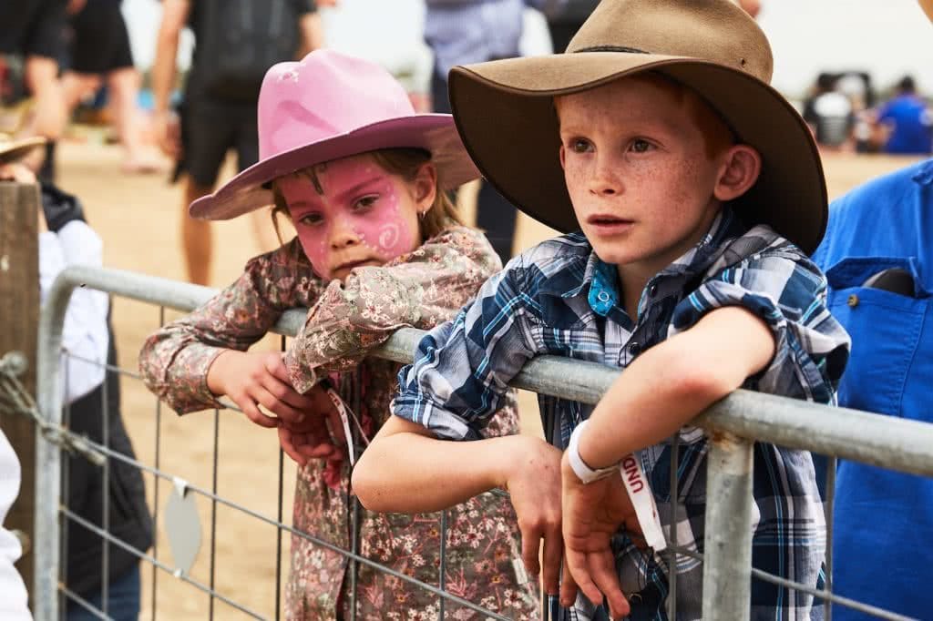 Fair Dinkum Aussie Fun At The Deni Ute Muster, Pat Corden, kids, face painting, fence, cowboy, cowboy hat