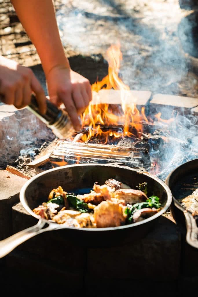 Feed The Camping Masses With This Crispy Eggy Breaky, photo by Jonathan Tan, fire, frypan, breakfast, hands