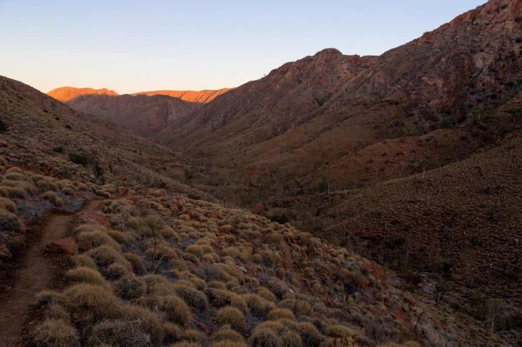 Capturing The Landscapes Of The Larapinta, Conor Moore, photo 8, rocky saddle, sunset, dusk, cliff, tussocks, red dirt, desert
