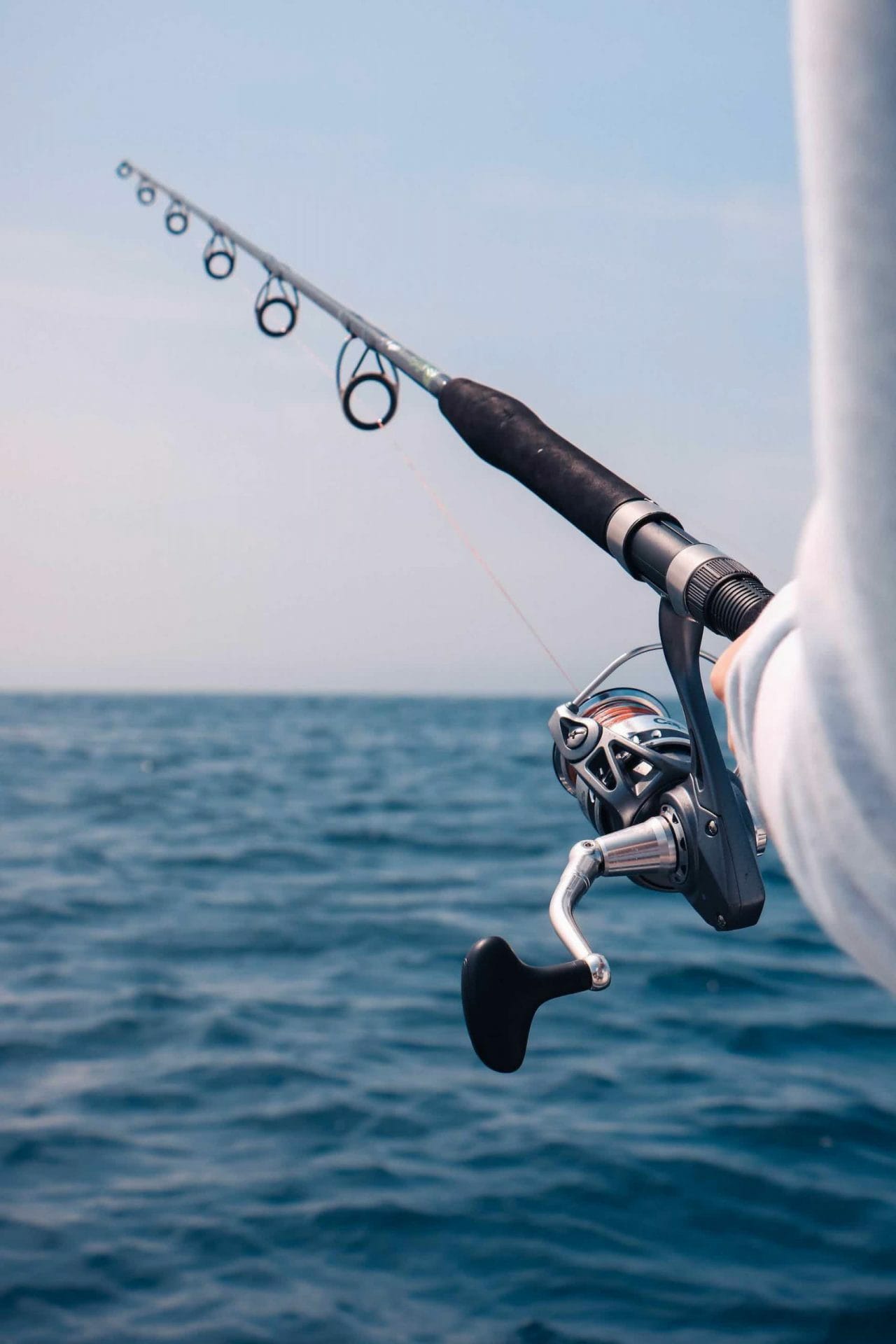 Best Fishing Spots In Sydney, photo by Mathieu Le Roux (unsplash), fishing rod, ocean