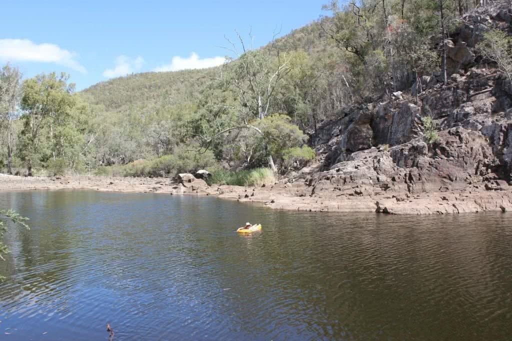 Sun-up to Sundown National Park – The Mt Donaldson Circuit (QLD), Saphira Schroers, photo by Mitchell Quinn, Floating on Permanent Waterhole, swimming, rocks