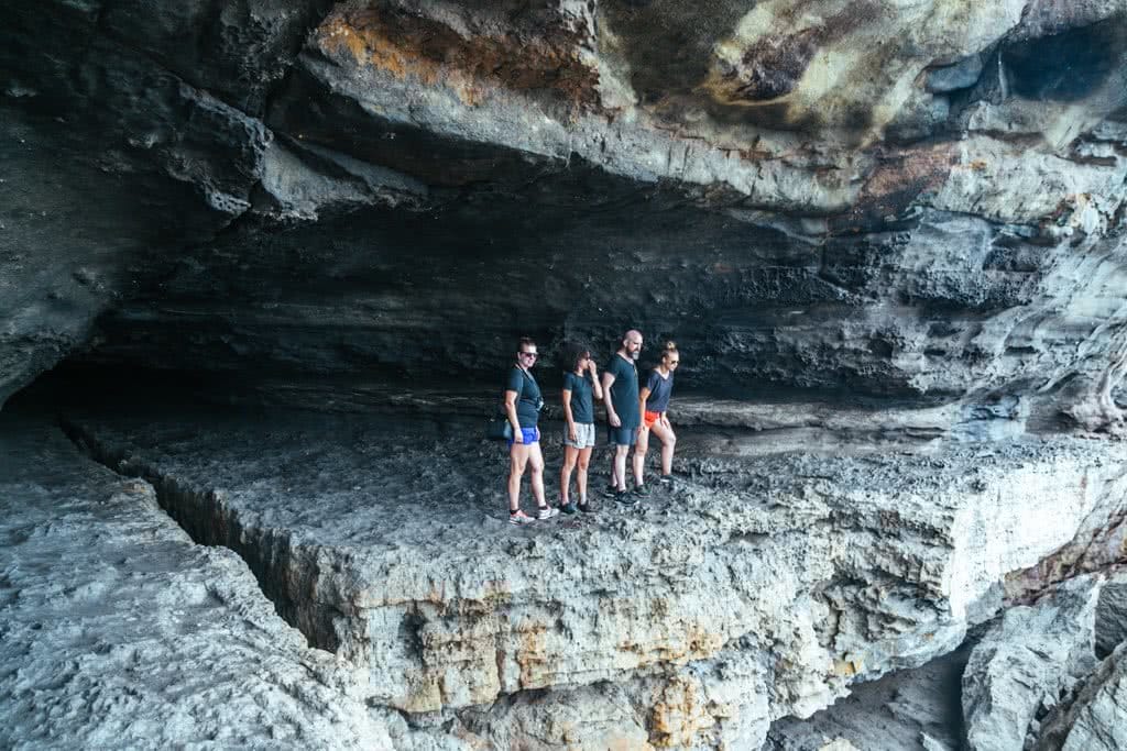 Scramble Through Gosang's Tunnel in Jervis Bay, Brooke Nolan, photo by Lindsay Buckley, people, rocks, cliff