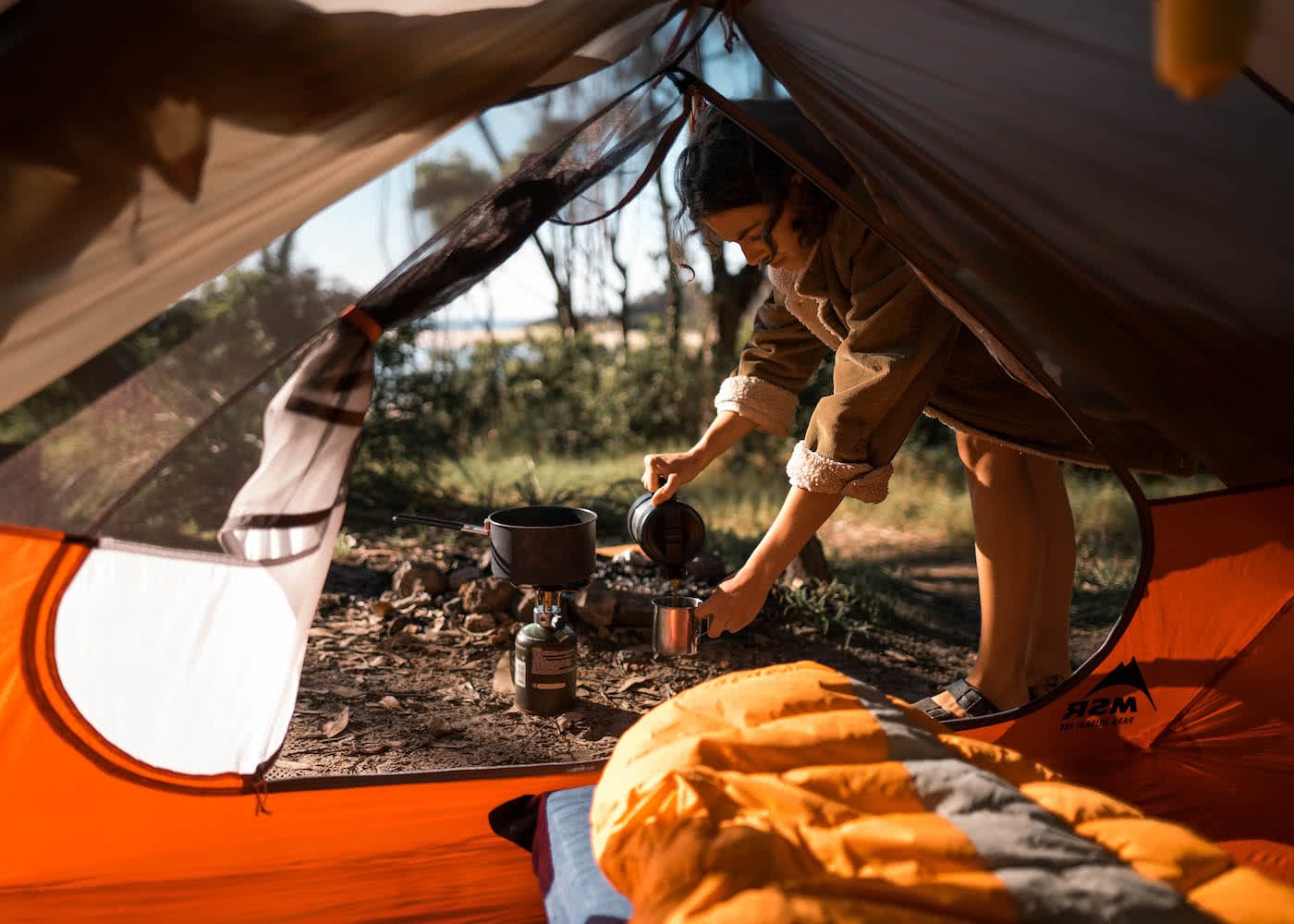 8 Great Reasons To Take Your Mates To Eurobodalla, photo by Fin Matson, tent, coffee, beach, woman, sleeping bag, view