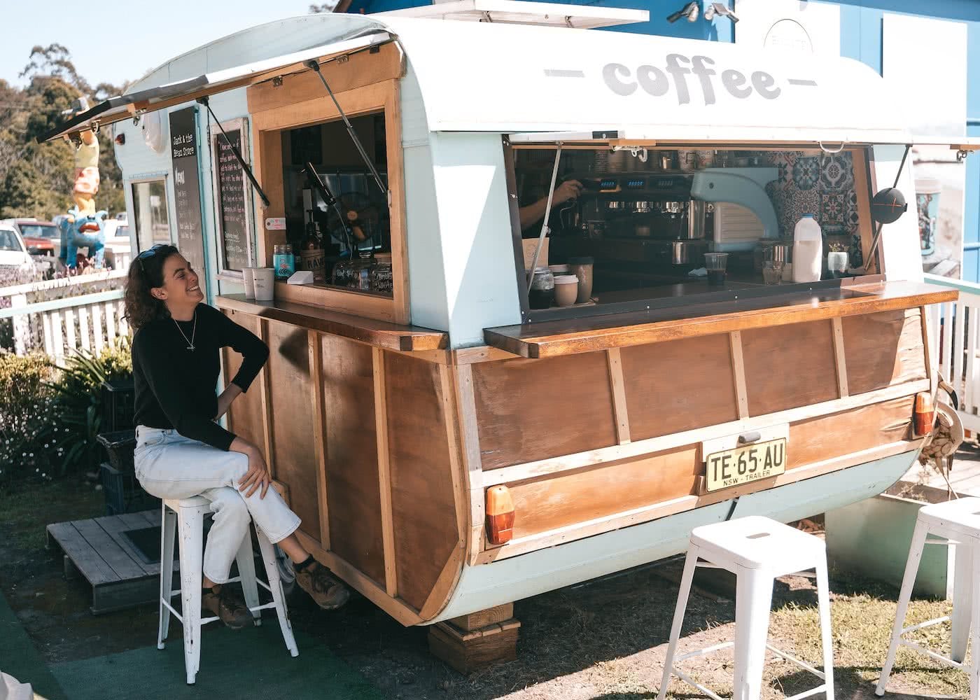 8 Great Reasons To Take Your Mates To Eurobodalla, photo by Fin Matson, Mogo, coffee shop, woman, laugh, caravan