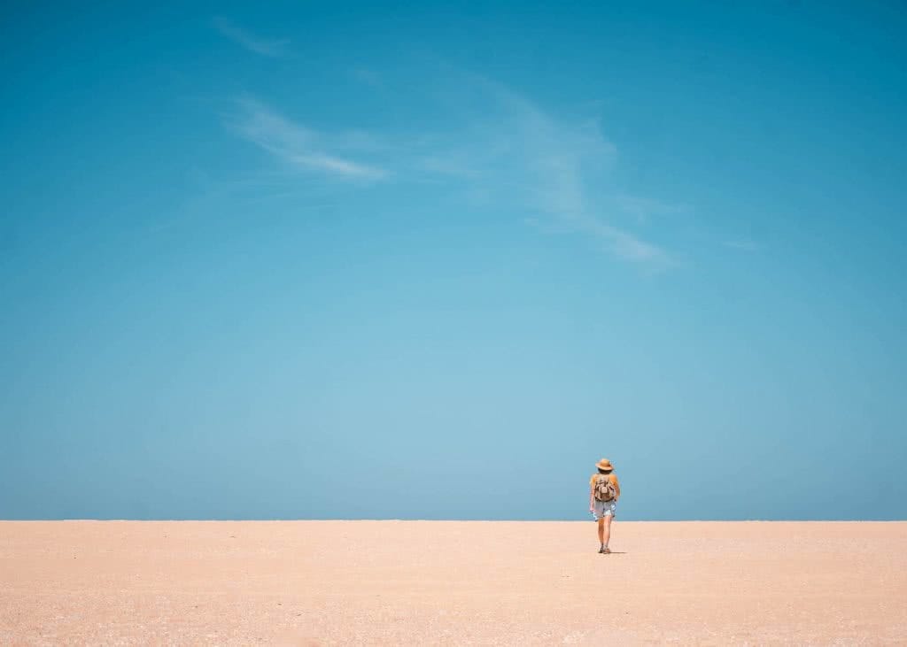 Step Back In Time Along The Bingi Bingi Dreaming Track // Eurobodalla (NSW), photo by Fin Matson, woman, hiking, beach, sky, sand