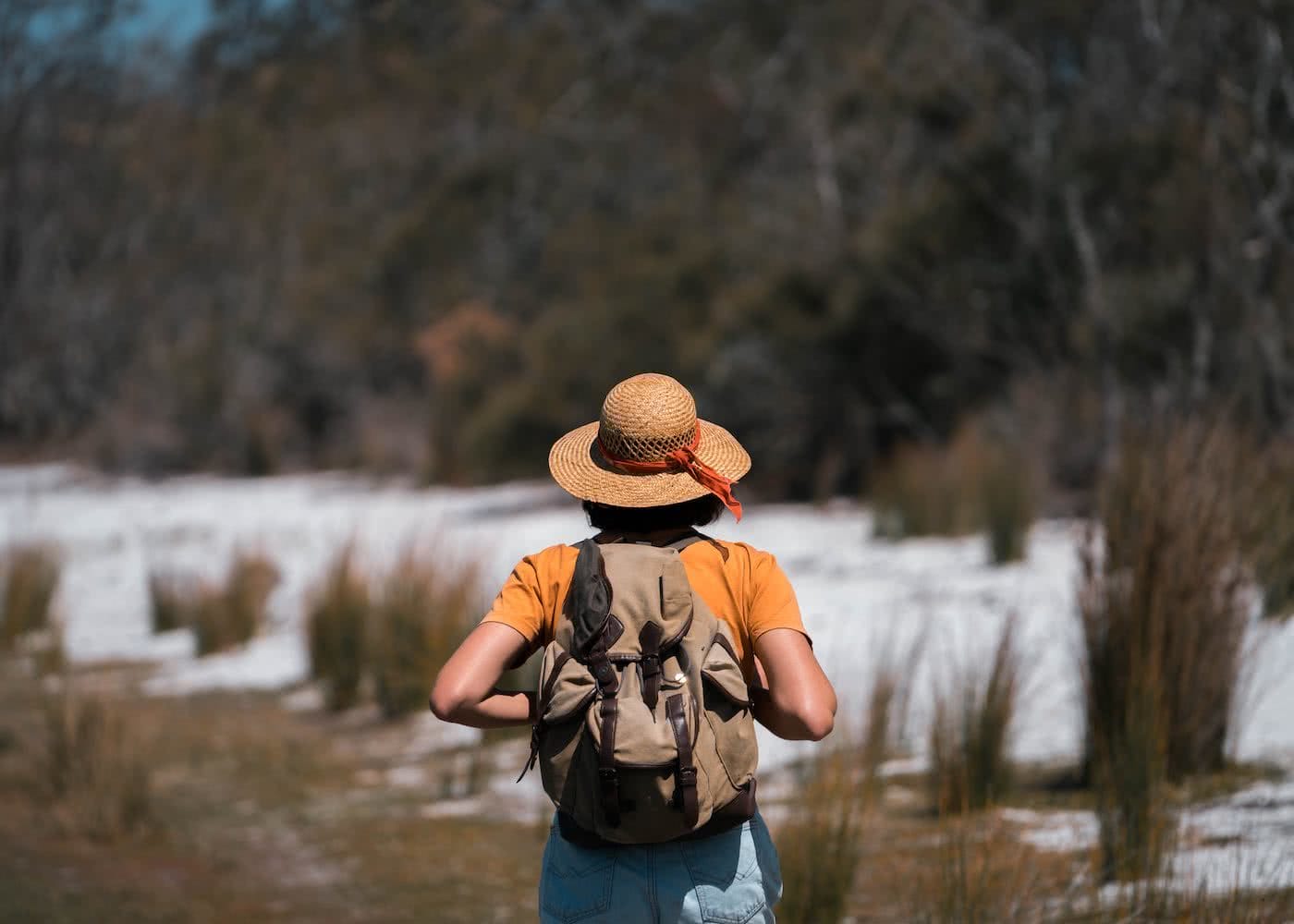Step Back In Time Along The Bingi Bingi Dreaming Track // Eurobodalla (NSW), photo by Fin Matson, woman, hat, hiking, sand, reeds