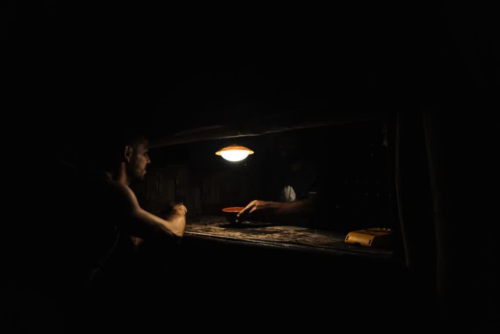 How a Visit to Vanuatu's Outer Islands Changed How I See the World, Ruby Claire, photos by Ben Savage and Ain Raadik, Ambrym, kava, drink, dark, night, man, light