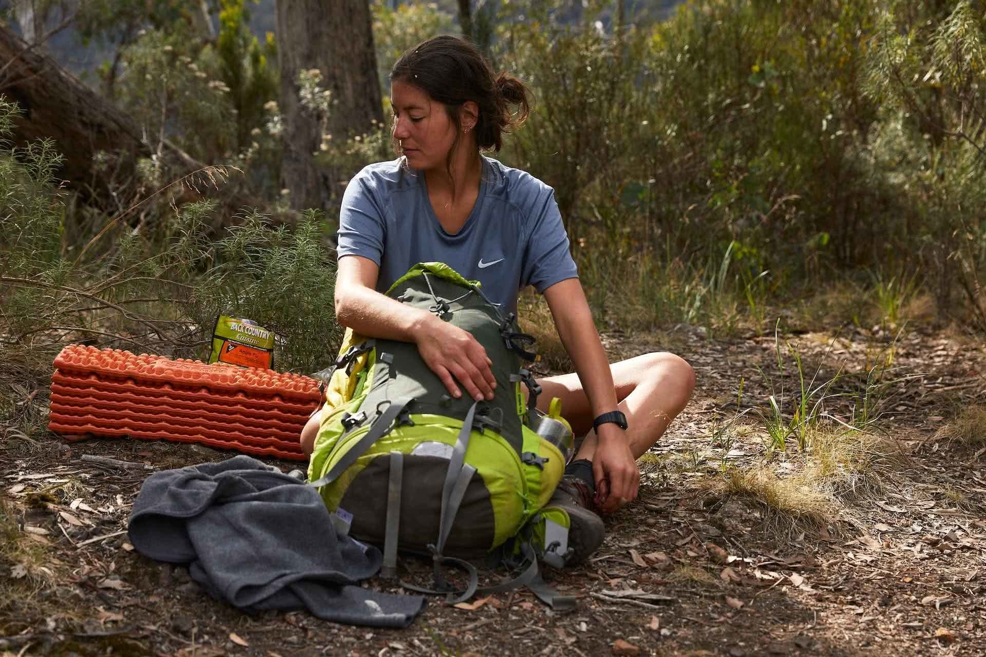 NEMO Switchback Ultralight Sleeping Pad – Gear Review, Pat Corden, woman, sleeping mat, pack, sitting, rest