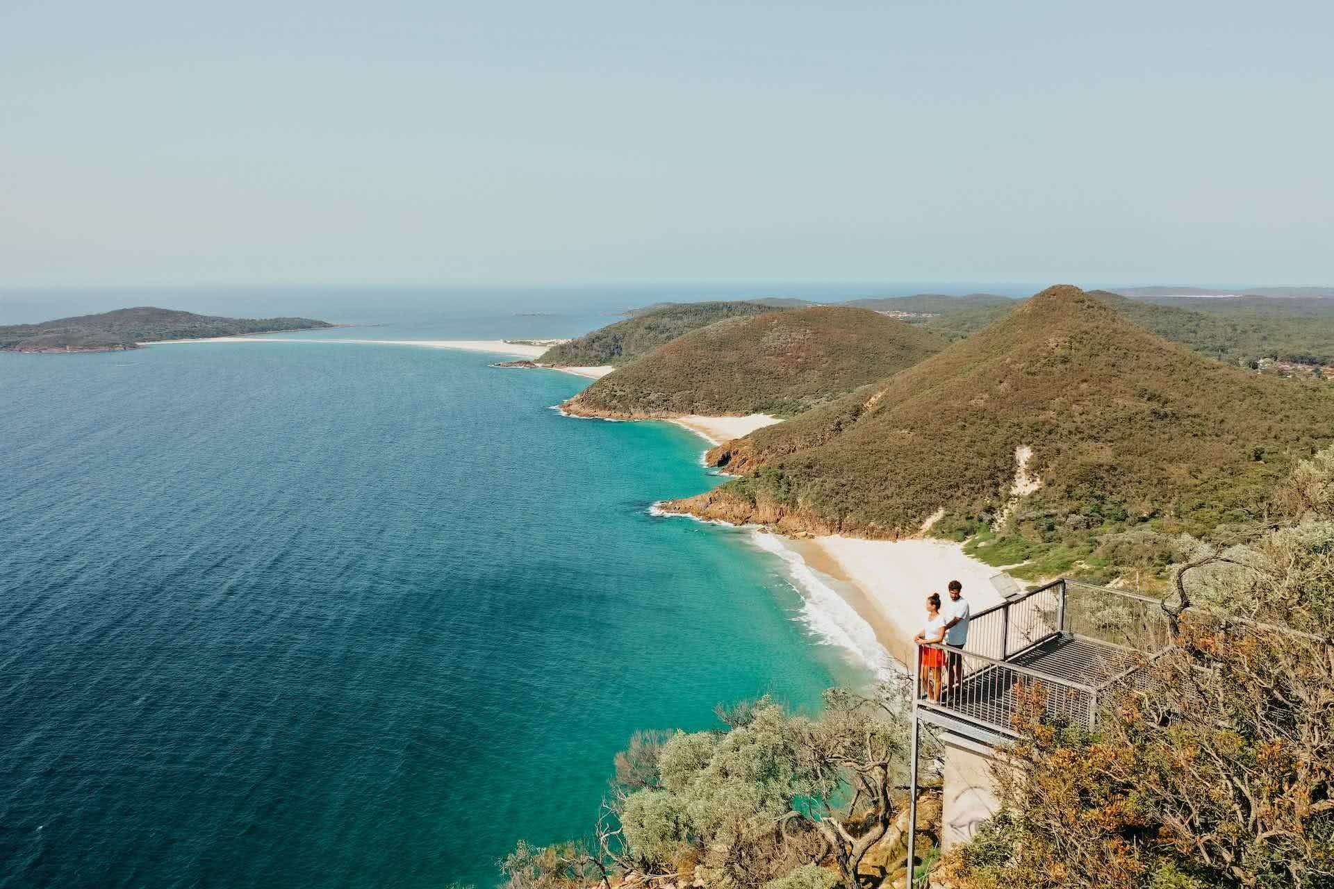 Plan Port Stephens for Your Next Adventure Weekender, photos by DNSW, Mt Tomaree, people, drone shot, lookout, ocean, beach, headlands