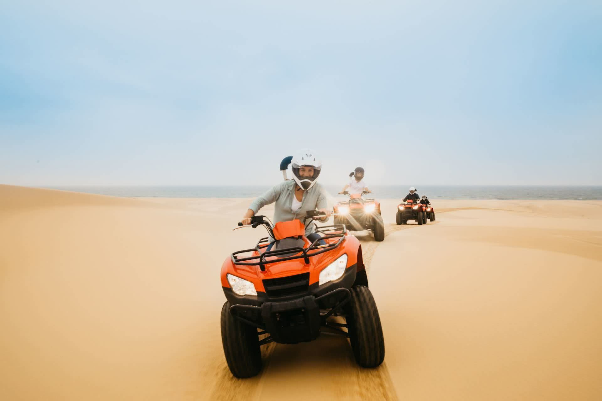 Plan Port Stephens for Your Next Adventure Weekender, photos by DNSW, Stockton sand dunes, quad biking, people