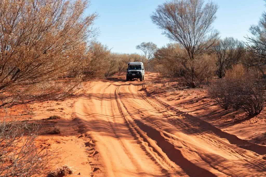 Lambert Centre of Australia – Down Under's Dead Centre (NT), Conor Moore, desert, red sand, scrub, car, 4WD, troopy, outback, dirt road