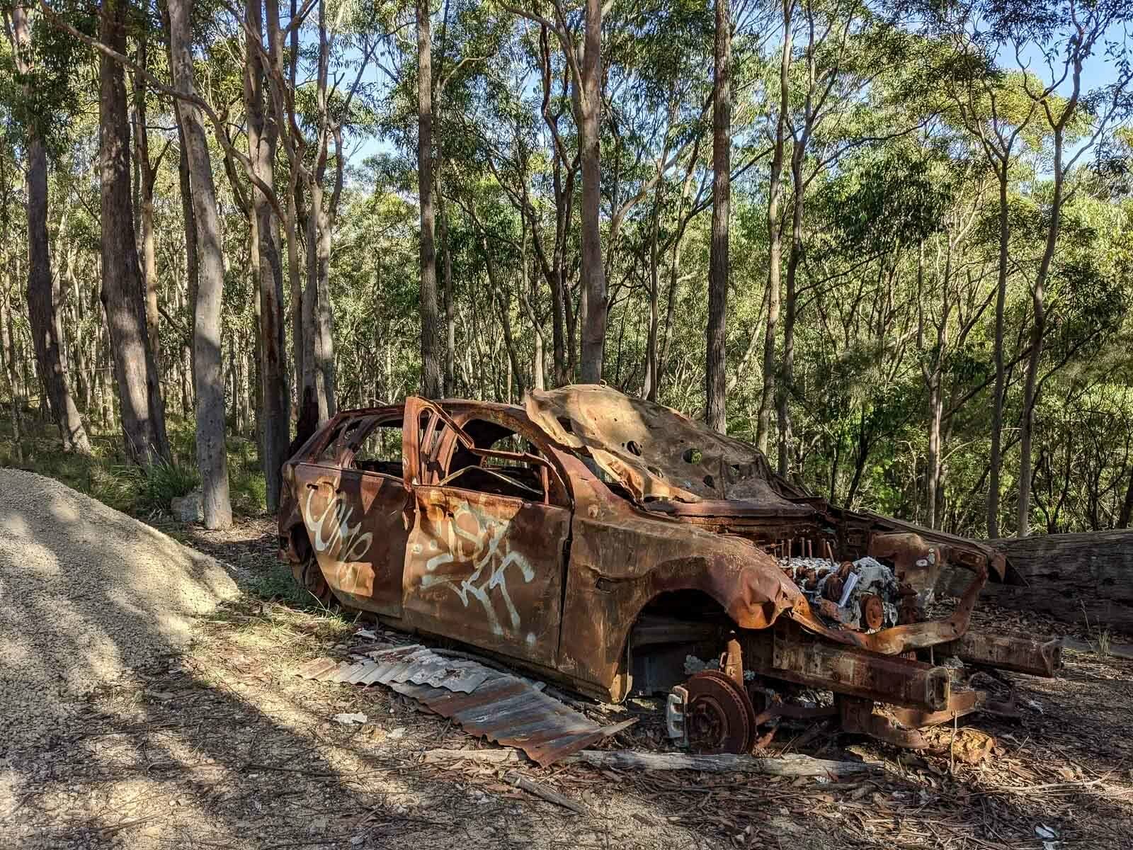 Hiking the Great North Walk – Sydney's 250km Thru Hike, jason reeves, sydney to newcastle, nsw, burnt out car